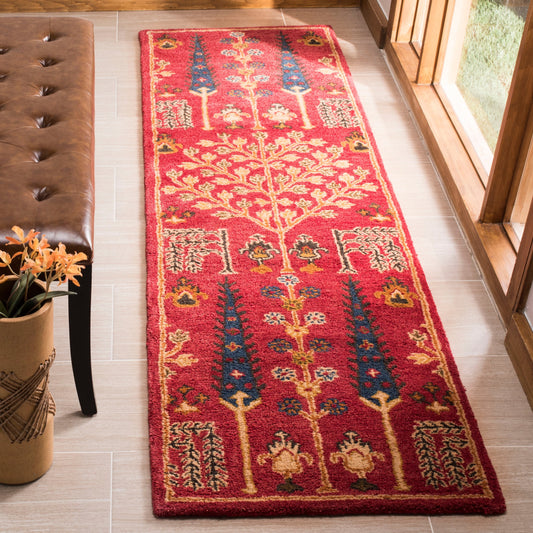 Tapis oriental traditionnel en laine SAFAVIEH fait main, motif floral, style classique.