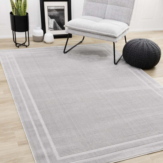Ellie High-Low Texturé Soft Polyester Grey Border Area Rug - 7'10 x 10'6|Carpette à poil long et court Ellie en polyester doux texturé à bordure grise - 7 pi 10 po x 10 pi 6 po