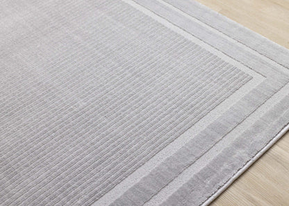Ellie High-Low Texturé Soft Polyester Grey Border Area Rug - 7'10 x 10'6|Carpette à poil long et court Ellie en polyester doux texturé à bordure grise - 7 pi 10 po x 10 pi 6 po