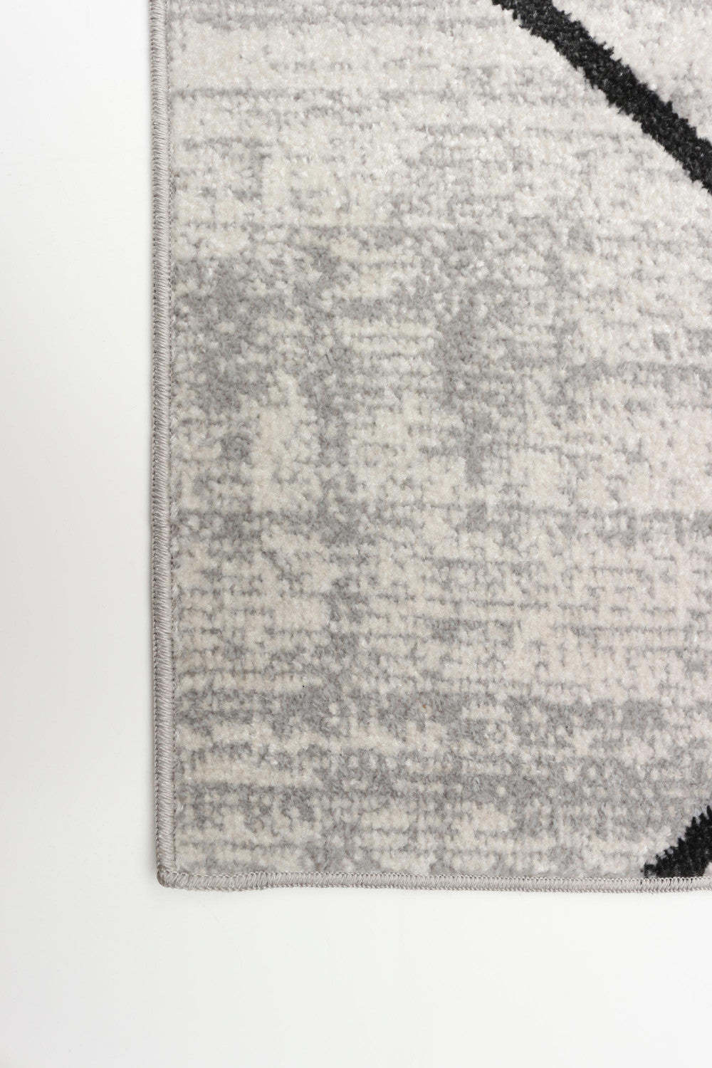 Tapis Damali ivoire/noir lavable en machine - 2'6 x 8'0|Carpette Damali ivoire et noire lavable à la machine - 2 pi 6 po x 8 pi 0 po|D86F17IZ