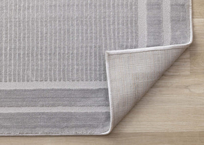 Ellie High-Low Texturé Soft Polyester Grey Border Area Rug - 7'10 x 10'6|Carpette à poil long et court Ellie en polyester doux texturé à bordure grise - 7 pi 10 po x 10 pi 6 po