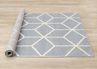 Tapis moderne géométrique bleu crème Ellis - 7'10 x 10'6|Carpette Ellis bleue et crème à motif géométrique moderne - 7 pi 10 po x 10 pi 6 po
