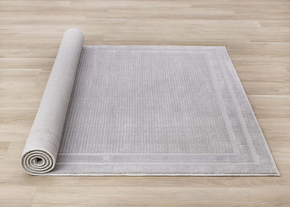 Ellie High-Low Texturé Soft Polyester Grey Border Area Rug - 7'10 x 10'6|Carpette à poil long et court Ellie en polyester doux texturé à bordure grise - 7 pi 10 po x 10 pi 6 po