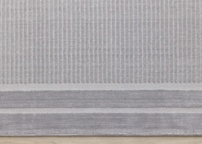 Ellie High-Low Texturé Soft Polyester Grey Border Area Rug - 7'10 x 10'6|Carpette à poil long et court Ellie en polyester doux texturé à bordure grise - 7 pi 10 po x 10 pi 6 po