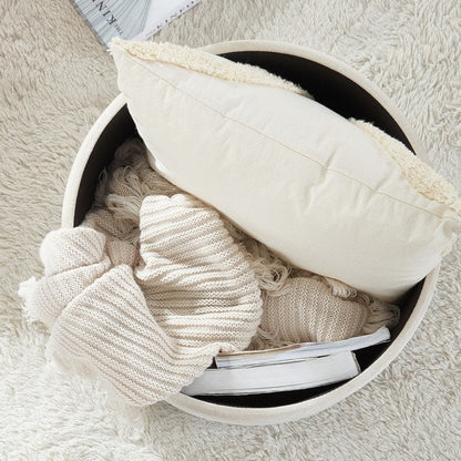 Pouf de rangement rond capitonné Donovan