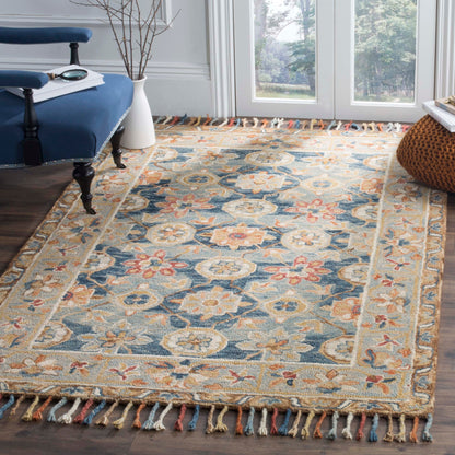 Tapis en laine à pompons bohème SAFAVIEH fait main en tremble Kimm