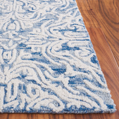 Tapis en laine moderne à motif floral Gertrida fait main SAFAVIEH