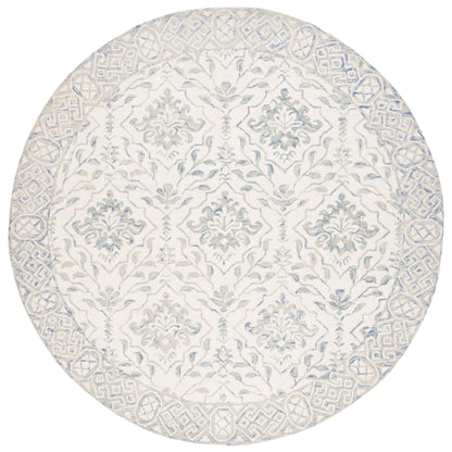 Tapis en laine Elvedina à motif floral, teint à la main par SAFAVIEH
