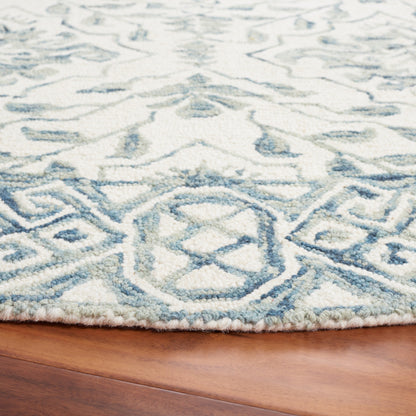 Tapis en laine Elvedina à motif floral, teint à la main par SAFAVIEH