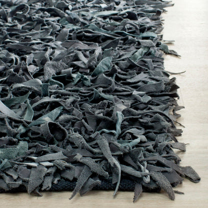 Tapis décoratif moderne SAFAVIEH en cuir shaggy fait main Doinita