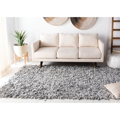 Tapis décoratif moderne SAFAVIEH en cuir shaggy fait main Doinita