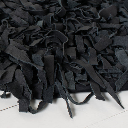 Tapis décoratif moderne SAFAVIEH en cuir shaggy fait main Doinita