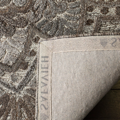 SAFAVIEH Tapis en laine à médaillon moderne Carlijn fait à la main