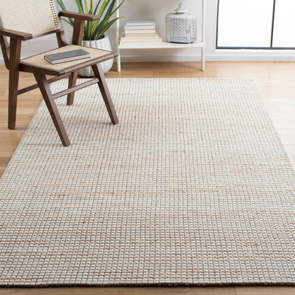 Tapis SAFAVIEH fait main en fibres naturelles Yareli, jute et laine.