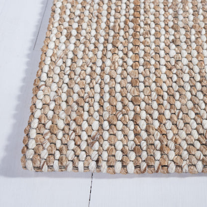 Tapis SAFAVIEH fait main en fibres naturelles Yareli, jute et laine.