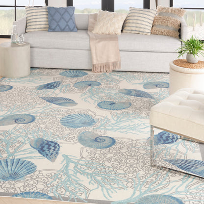 Tapis d'intérieur/extérieur Waverly Sun &amp; Shade Shore Thing Tropical Sea Shell Floral