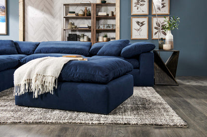 Canapé sectionnel modulaire Eclipse 4 pièces en tissu d'apparence lin avec pouf et coussins réversibles en couette et plumes - bleu marine